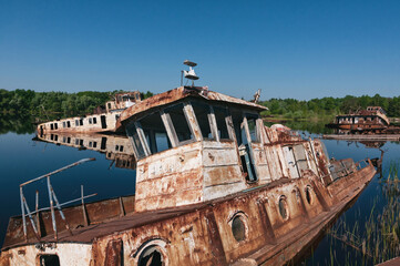 Abandoned sunken Barges Boats On River Pripyat in Chernobyl exclusion Zone. Chernobyl Nuclear Power...
