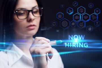 Business, Technology, Internet and network concept. Young businessman working on a virtual screen of the future and sees the inscription: Now hiring