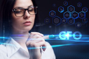 Business, Technology, Internet and network concept. Young businessman working on a virtual screen of the future and sees the inscription: CFO