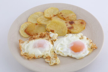 fried eggs with potatoes