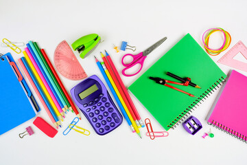 School supplies scene. Flat lay over a white background. Back to school concept.
