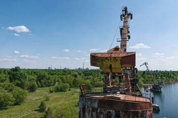 Abandoned dock cranes in Prypiat, Chernobyl exclusion Zone. Chernobyl Nuclear Power Plant Zone of...
