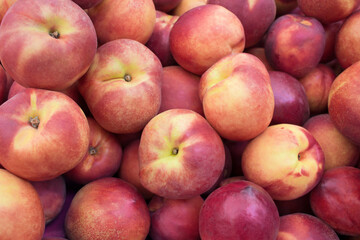 Fototapeta na wymiar Fresh organic peach. Heap of fresh ripe peaches.