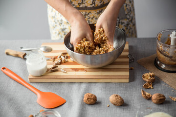 Woman mashing blender mixture into a bowl