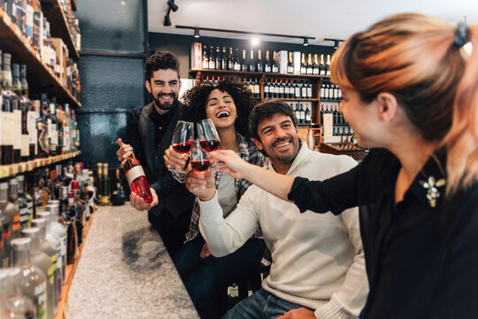 Friends tasting wine in the winery