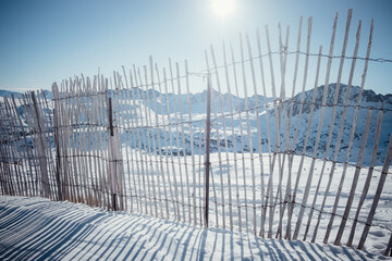 Reflection of the fence in the sun in the mountains. Andorra GrandValira Ski. Pyrenees Mountains