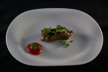 Freshly cooked steak on a white plate
