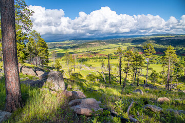 Wyoming countryside aerial view at sunset, amazing hills surrounding Devils Tower