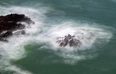 Rising tide envelop rocks.