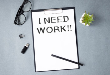 I Need work sign on a board. Economic crisis concept. Unemployment concept.