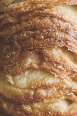 Close-up of homemade cruffins. Artisan pastry. 
