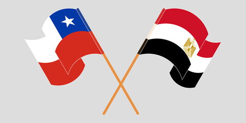 Naklejka premium Crossed and waving flags of Egypt and Chile