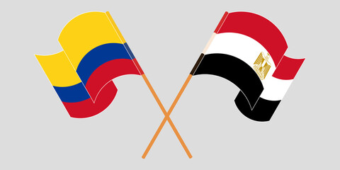 Crossed and waving flags of Egypt and Colombia