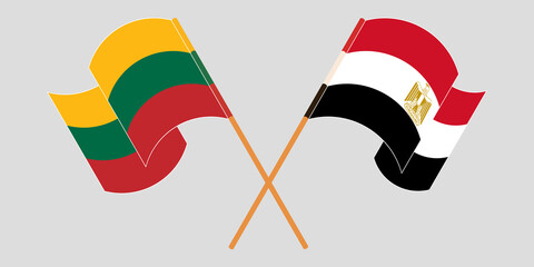 Crossed and waving flags of Egypt and Lithuania