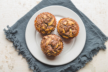 Freshly Baked Banana Chocolate Walnut Muffin on White Plate-  Trio  Zoom Out Flat lay