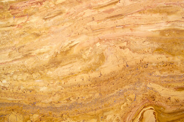 Granite texture background of natural stone with polished yellow streaks. marble texture used for indoor and outdoor home decoration