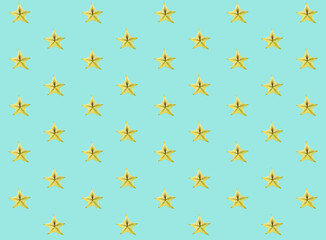 Pattern of fresh fruits slices on pastel background from top view.