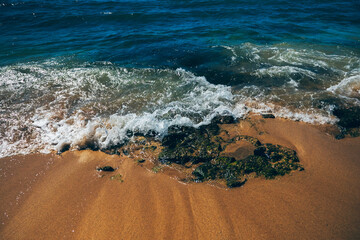 Waves hitting the rocks on the Poipu beach, Kauai Hawaii USA