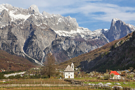 Theth Village and snow capped mountains in Thethi Valley, Albania