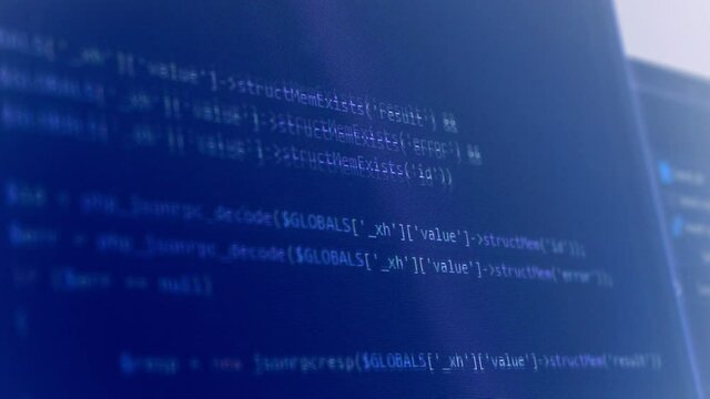 Computer programming code running over dark screen