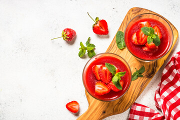 Cheesecake in the glasses with fresh strawberry.