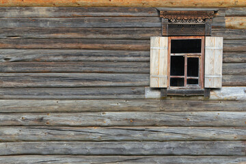 Window and the wall of traditional russian log house