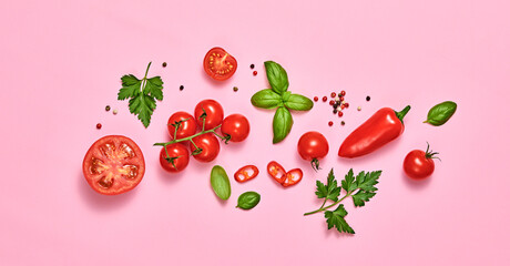 Tomato, basil, spices, bell chili pepper. Vegan diet food, creative composition on pink. Fresh basil, herb, cherry tomatoes layout, cooking sauce colorful concept, top view.