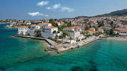 Aerial drone bird's eye view photo of picturesque neoclassic houses in historic and traditional island of Spetses with emerald clear waters, Saronic Gulf, Greece © aerial-drone
