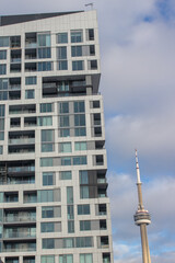 Modern Condominium Building in Front of Tower
