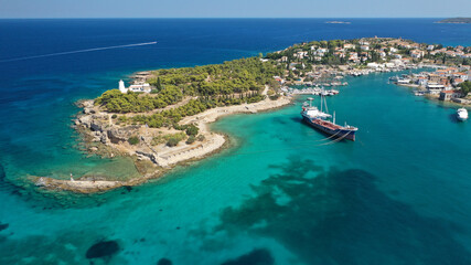 Fototapeta na wymiar Aerial drone bird's eye view photo of picturesque neoclassic houses in historic and traditional island of Spetses with emerald clear waters, Saronic Gulf, Greece