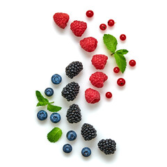 Blueberry, raspberry, blackberry, redcurrant isolated on white. Fresh blueberry, berries closeup. Ripe red raspberry, blue blackberry creative composition. Colorful trendy concept, top view.