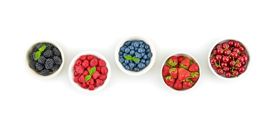 Blueberry, raspberry, blackberry, strawberry, cherry isolated on white. Fresh blueberry, berries closeup. Ripe raspberry, strawberry creative composition. Colorful berry concept