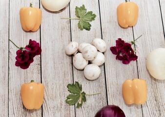 Fresh harvested organic vegetables arranged in attractive appealing simple knolling pattern to entice healthy eating lifestyle habits 
