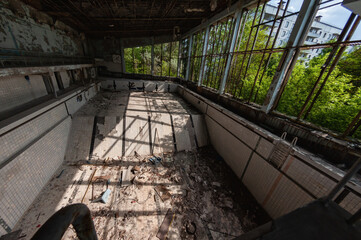 Azure Swimming Pool in Pripyat, Chernobyl exclusion Zone. Chernobyl Nuclear Power Plant Zone of...