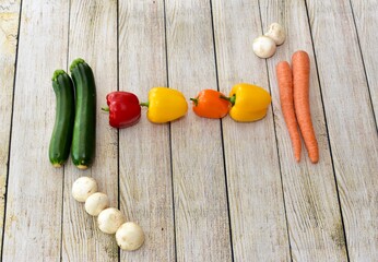 Fresh wholesome vegetarian ingredients of organic vegetables arranged in simplistic and artistic knolling pattern to show attractive healthy ingredients