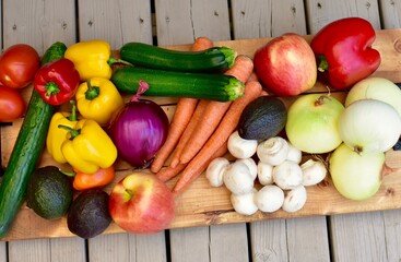 Fresh organic summer harvested vegetables washed and ready for preparing healthy meals and side dishes to share as a family