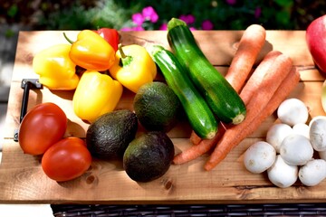 Fresh organic summer harvested vegetables washed and ready for preparing healthy meals and side dishes to share as a family