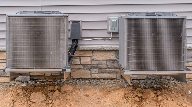 Dual Outdoor Air Conditioning HVAC Unit Installed On A New American Single Family Home 