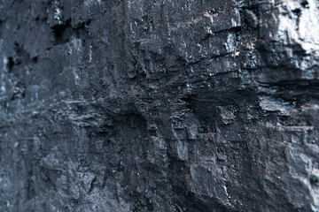Shimmering edge of big chunk of black coal