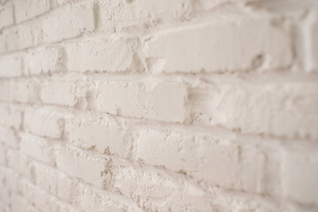 white stone brick wall, uneven stone background, place for text, horizontal photo, side view, close-up