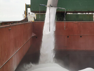 Loading of urea in bulk into cargo hold in progress