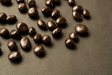 Dark chocolate drops on a dark background