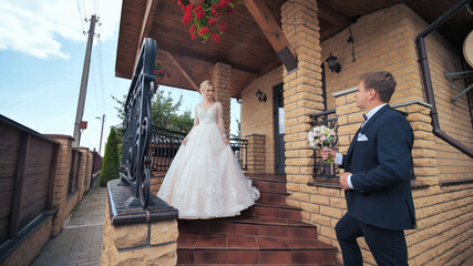 Fototapeta premium The groom meets his bride and gives her a bouquet.