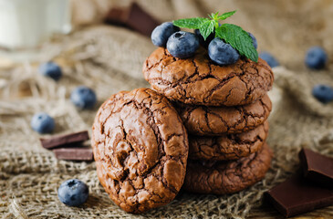 Chocolate brownie cookies with berries and mint leaves