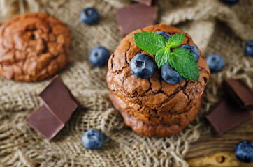 Chocolate brownie cookies with berries and mint leaves