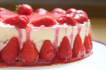 Sweet strawberry cheesecake close up view