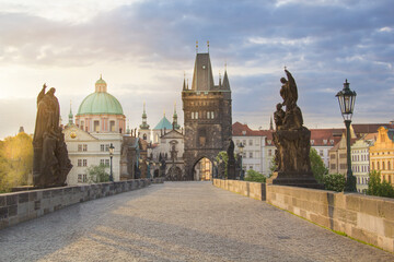 Beautiful view of Old Town Tower of Charles Bridge at dawn in Prague, Czech Republic