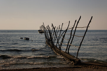 Traditional method of storing fishermen's boats in Savudrija, Croatia; idyllic scene taken at twilight; seascape, travel photography