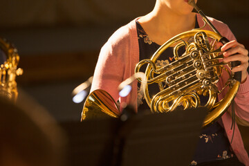 Woman playing french horn