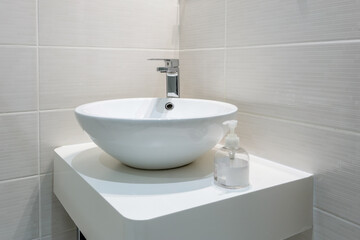 White washbasin in the bathroom, in the house, hotel. Conceptual photo.